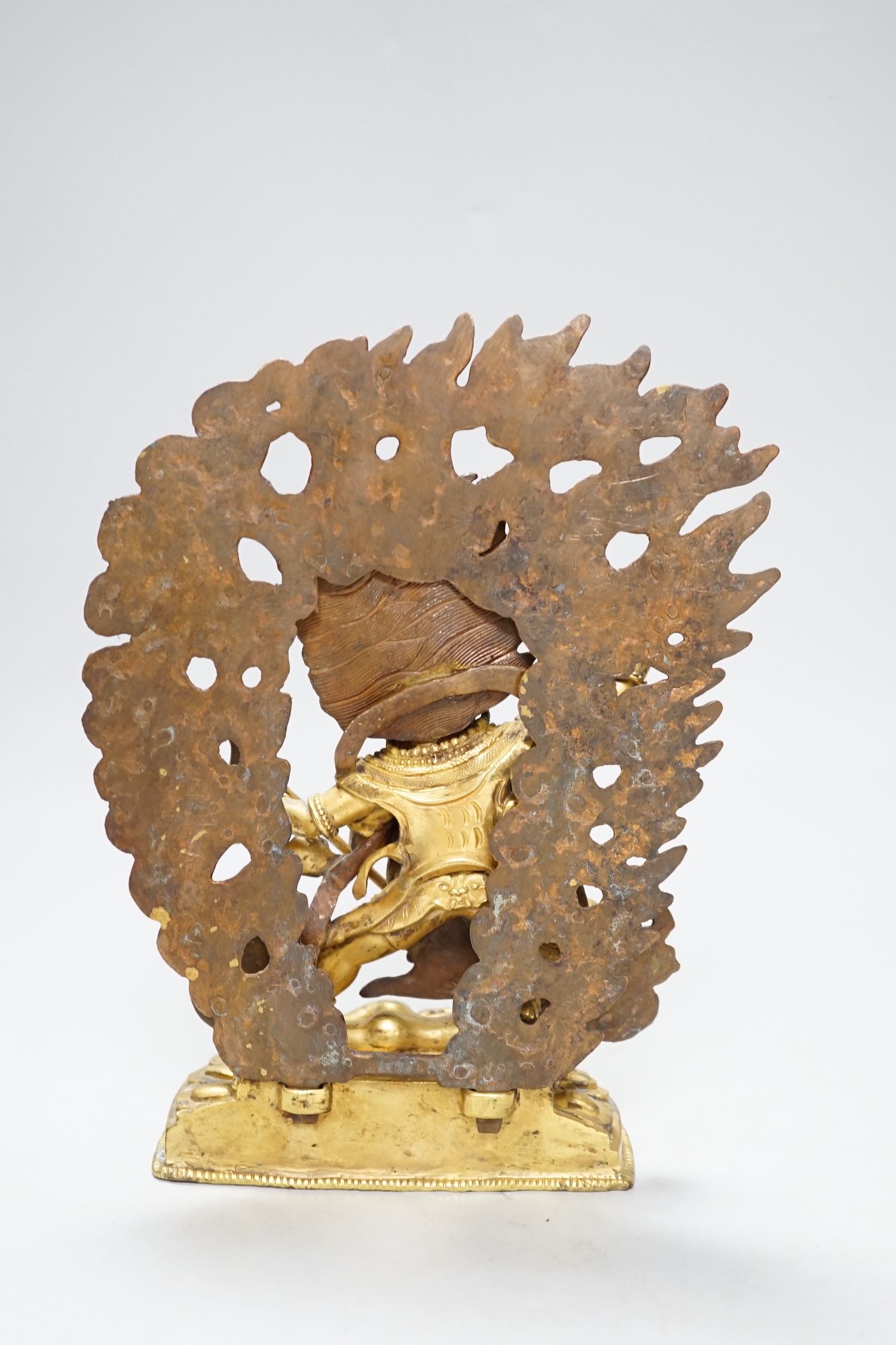 A Sino Tibetan gilt bronze figure of Mahakala, 23cm